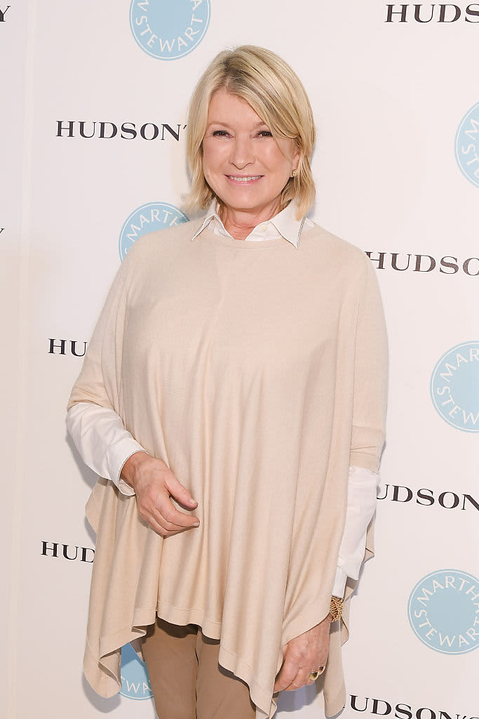 Martha Stewart in a beige sweater and white collared shirt