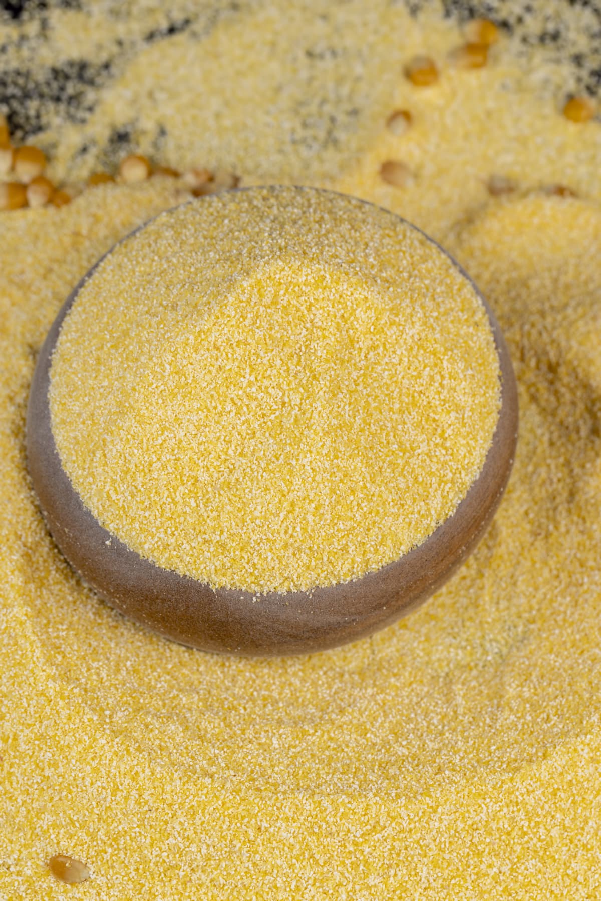yellow corn grain flour for cooking polenta porridge, dry yellow polenta porridge close-up