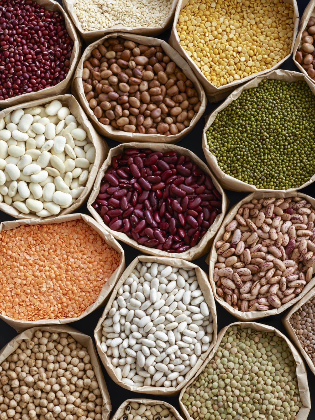 Colorful selection of pulses in paper bags