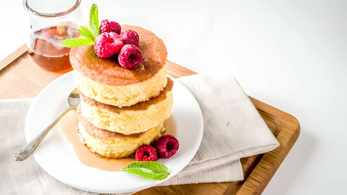 Japanese souffle pancakes stacked with raspberries on top