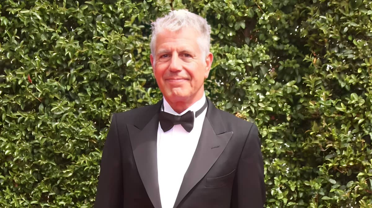 Anthony Bourdain in a tuxedo and bow tie