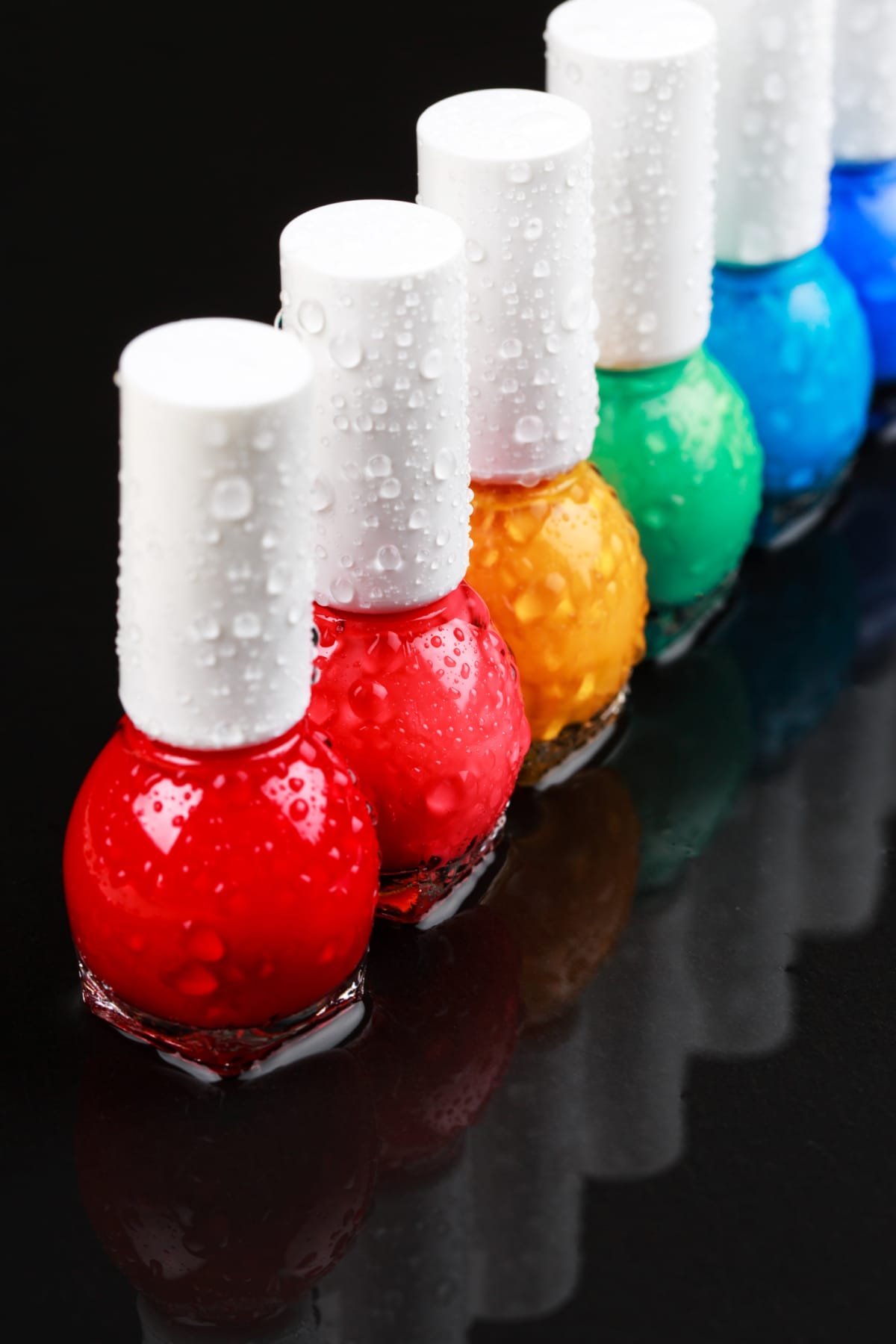 Colorful nail polish bottles lined up