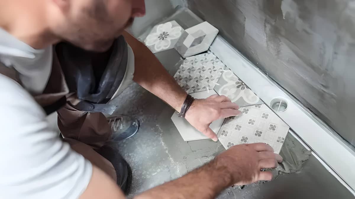 A man adjusting tiles 