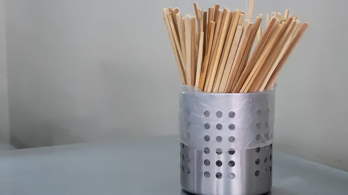 A stand filled with chopsticks.