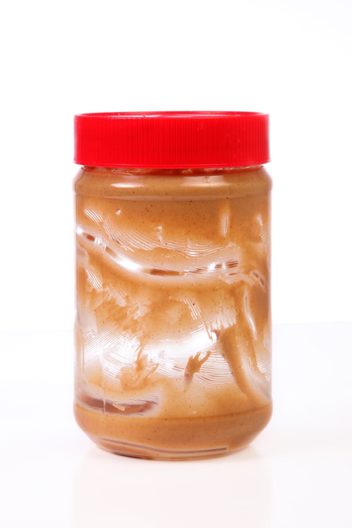 A nearly empty jar of Peanut Butter.