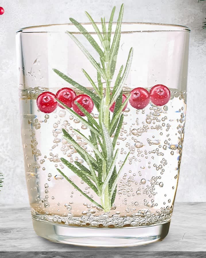 Rosemary sprig in a glass of cocktail 