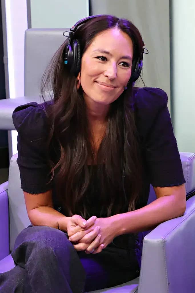 Joanna Gaines seated, wearing a headset