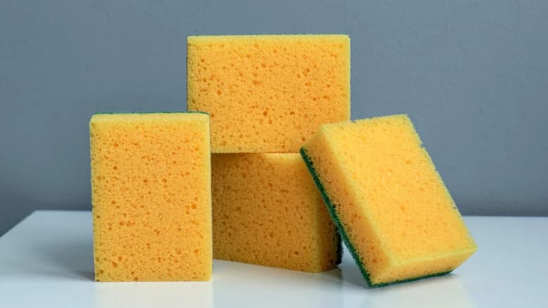 Snipping A Corner Off Of Your Kitchen Sponge Has One Major Benefit