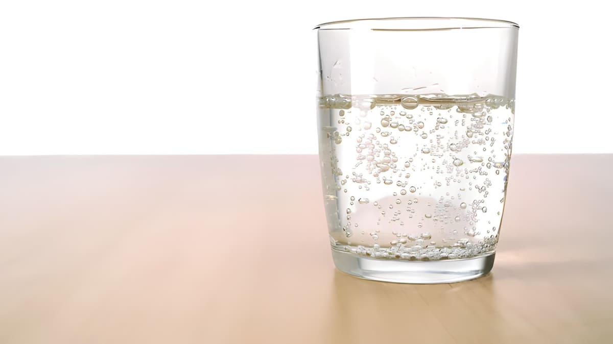 Sparkling water bubbling in a glass