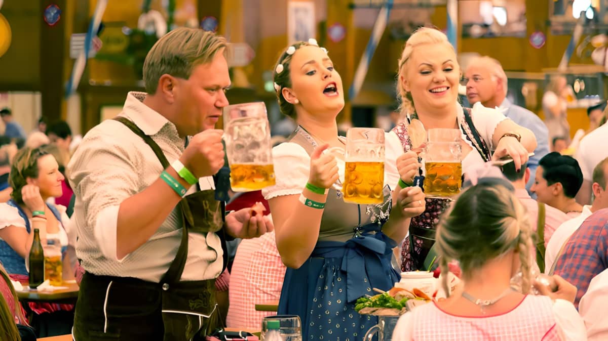 People celebrating Oktoberfest and drinking beer