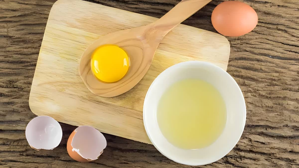 Egg yolk on a spoon.