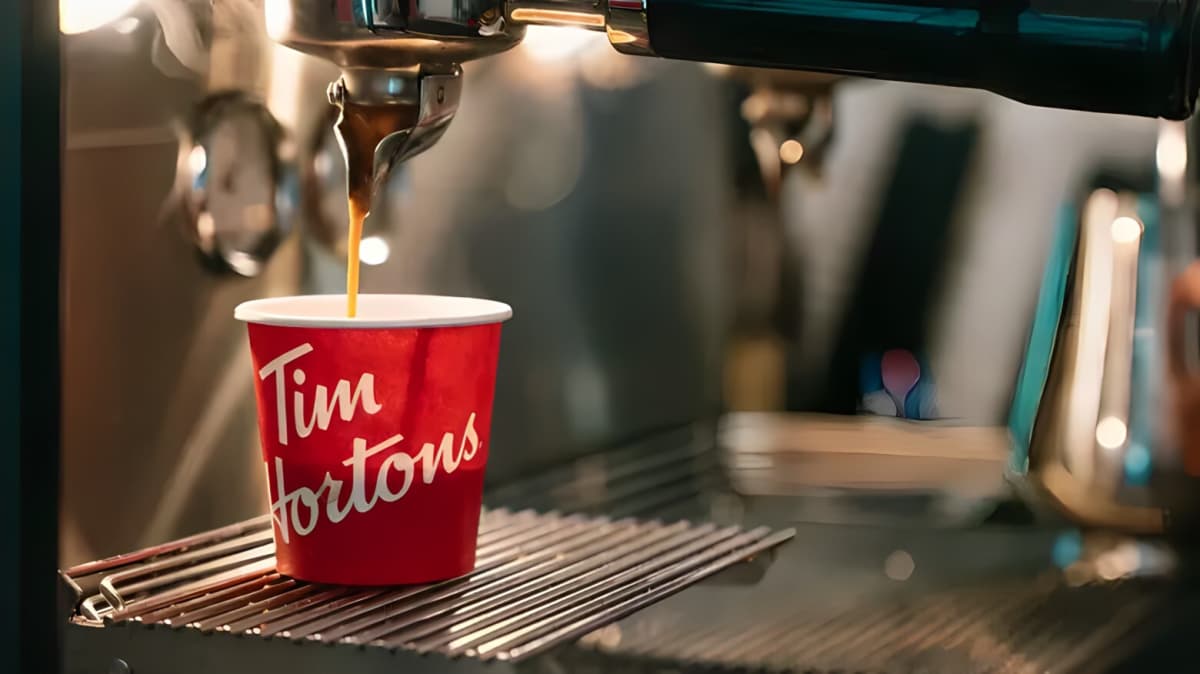 Coffee being poured at a Tim Hotons.
