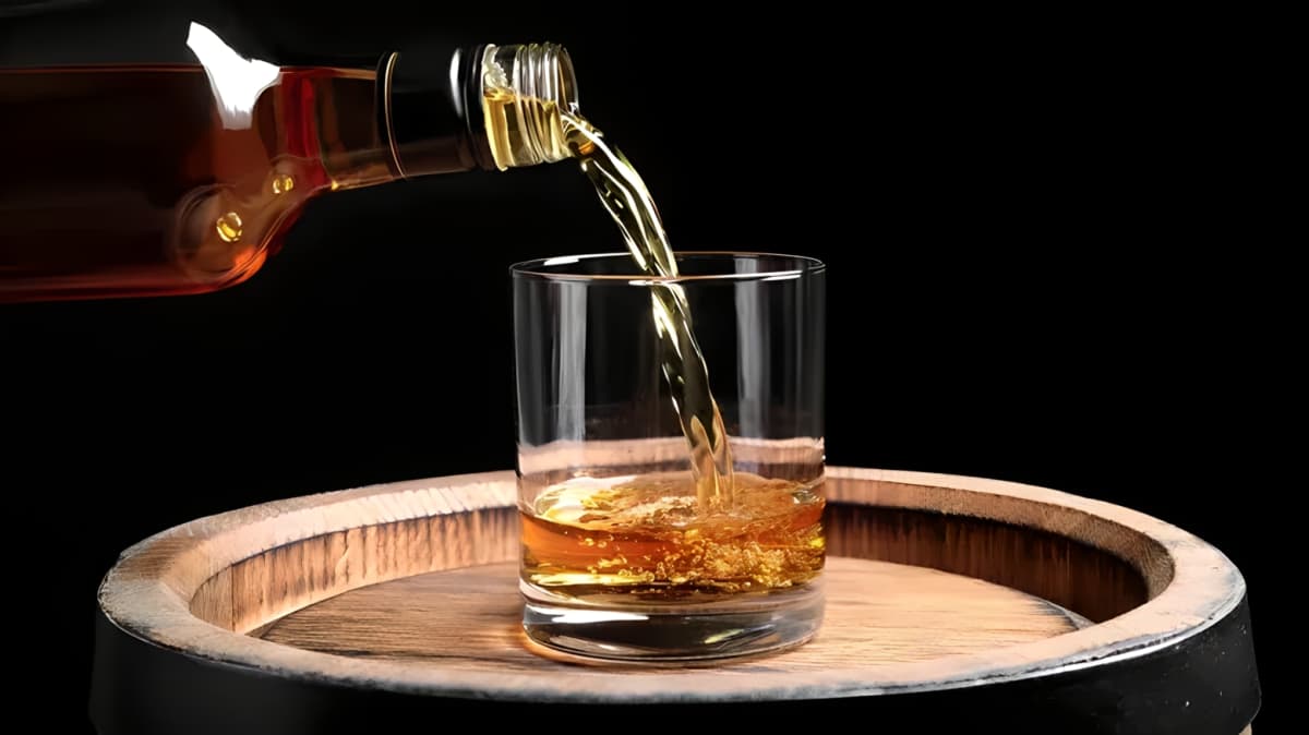 Whisky pouring into a glass.