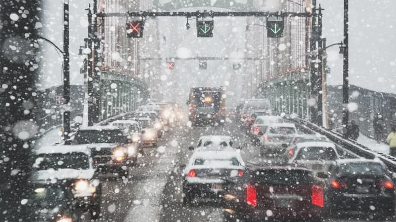 Rows of traffic during a snowfall