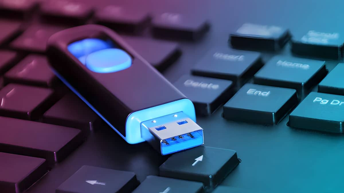 Black and blue flash drive on a keyboard