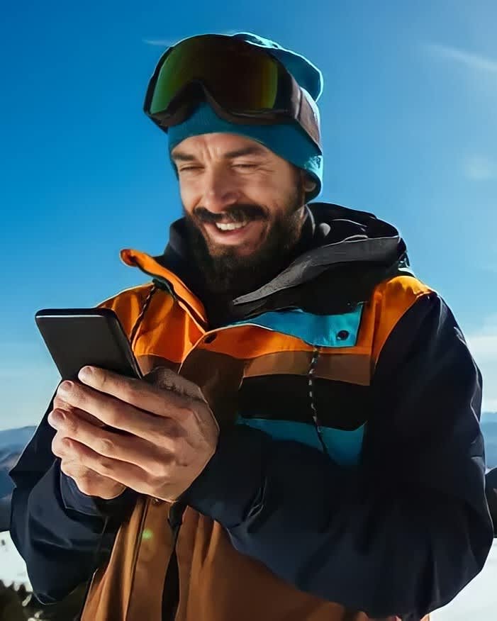 Skier using phone