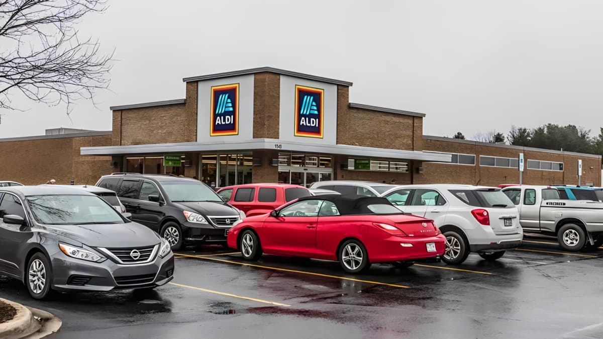 An Aldi store with cars parked in front